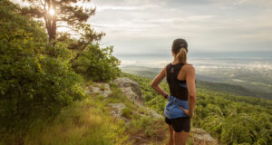 A woman overlooking a mountain.